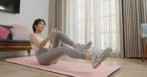 Young Chinese woman exercising at home,4K