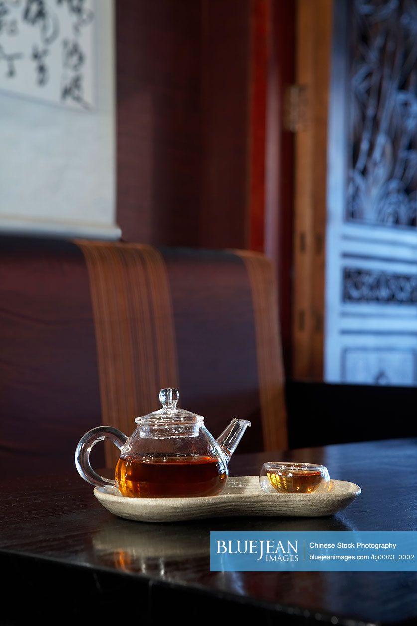 Glass Teapot And Cup On Table