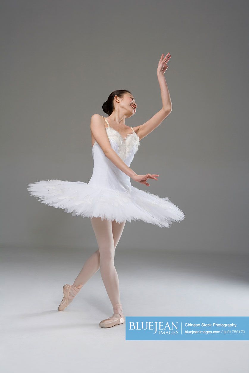 Chinese ballerina performing in a white tutu