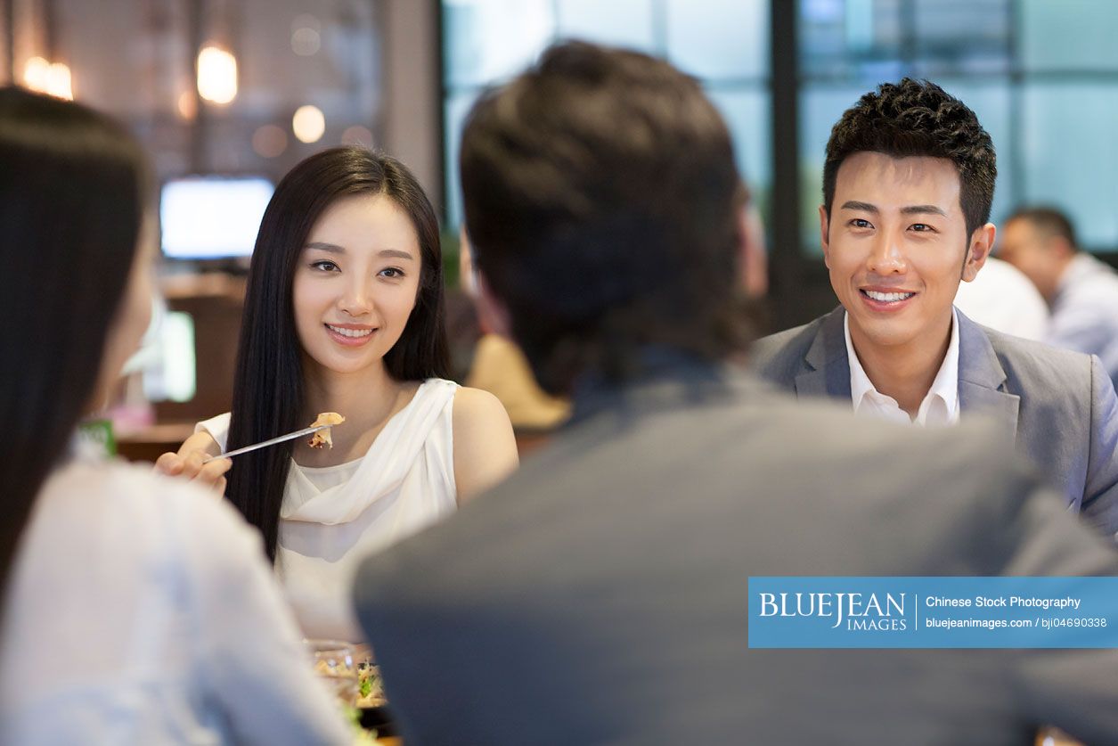 Chinese friends having dinner together