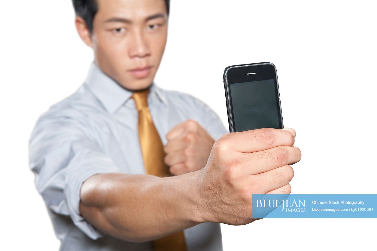 Chinese businessman holding iPhone
