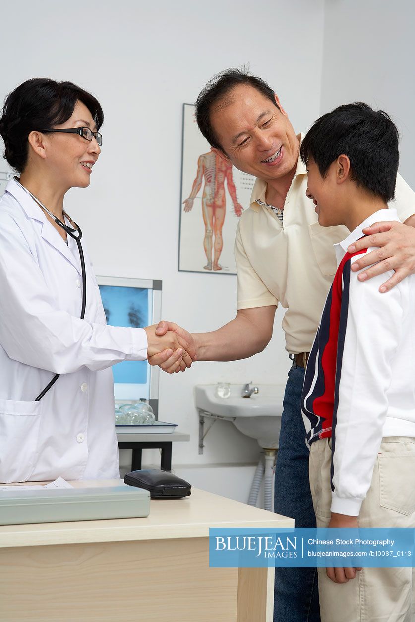 Chinese Doctor Shaking Hands With Man