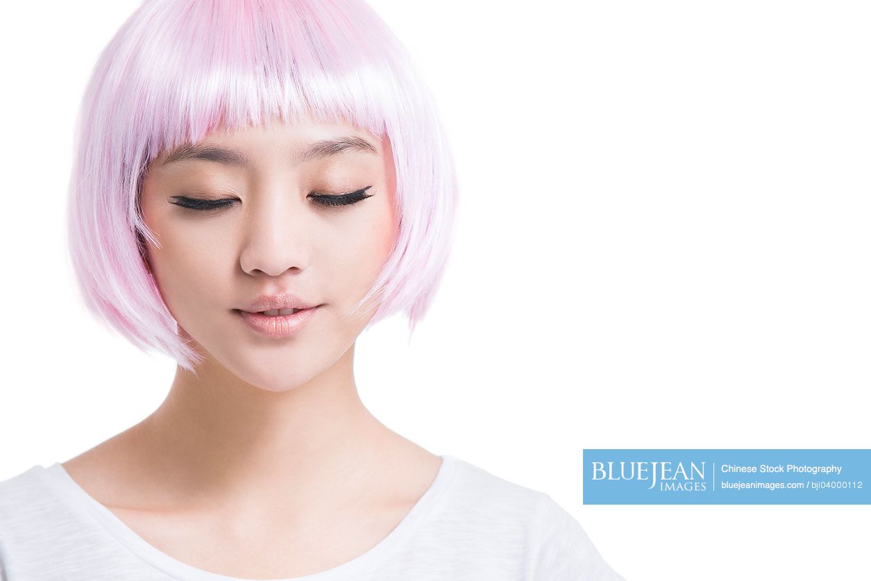 Young Chinese woman with pink wig