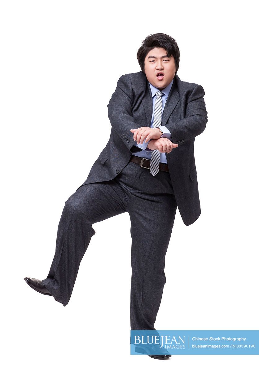 Happy overweight businessman dancing
