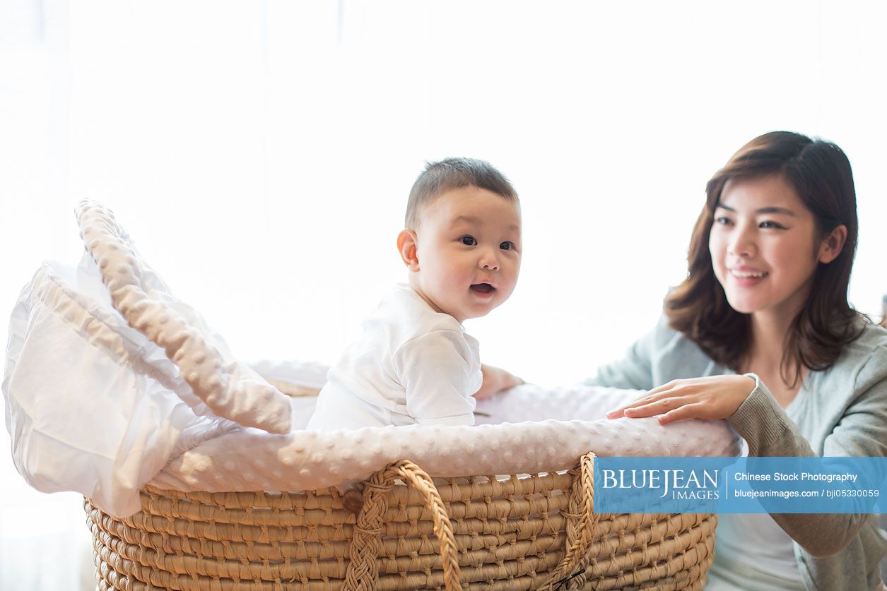 Happy Chinese mother and cute baby at home-High-res stock photo for ...