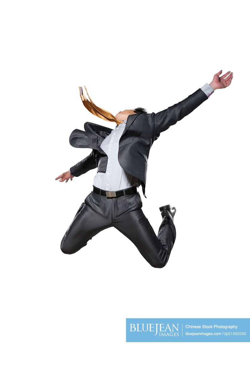Chinese businessman jumping in the air