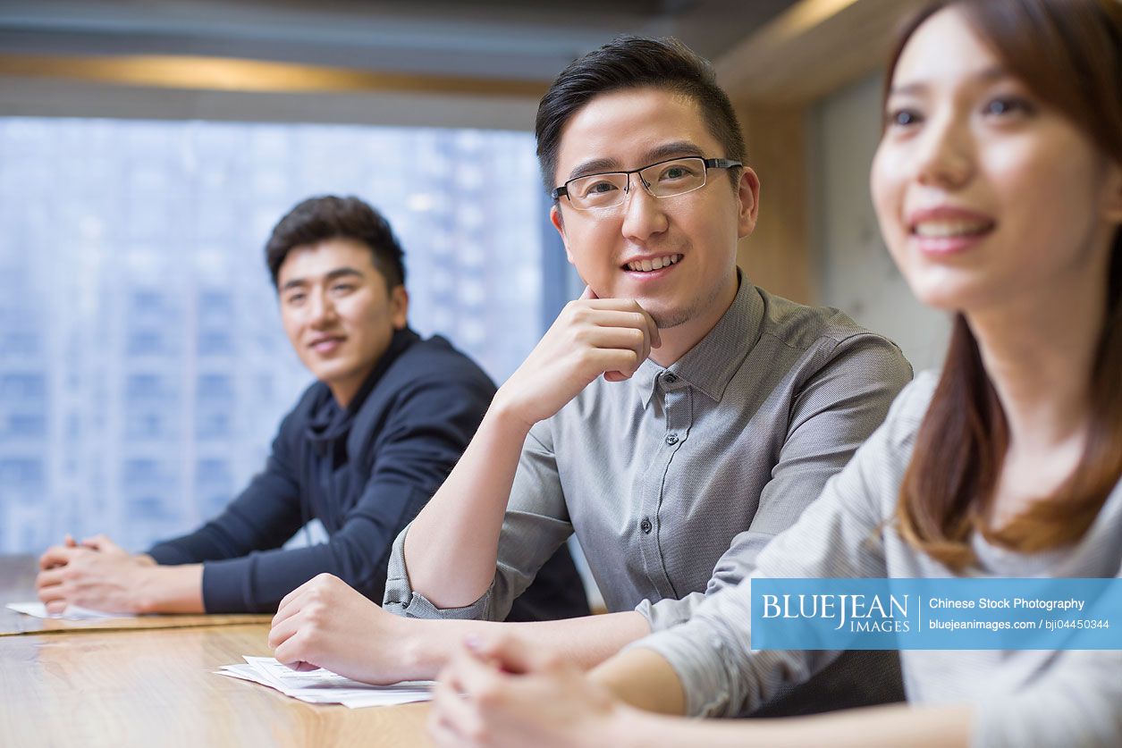 Chinese business people having a meeting in board room