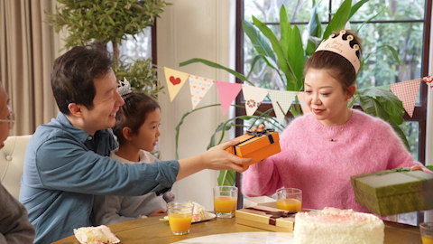 Family celebrating birthday with joy and laughter