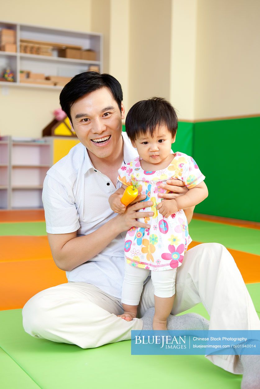 Chinese father playing with daughter