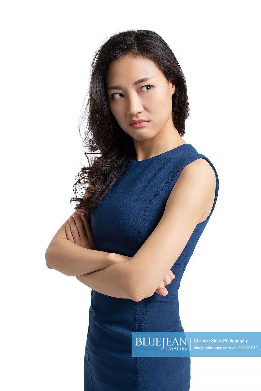 Young Chinese businesswoman looking angry