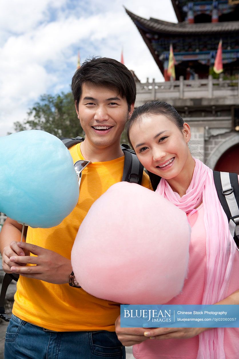 Young Chinese couple with cotton candy in Dali