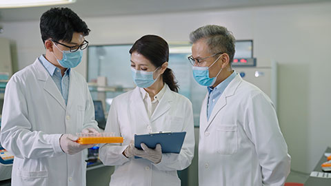 Three Chinese researchers discussing in laboratory,4K