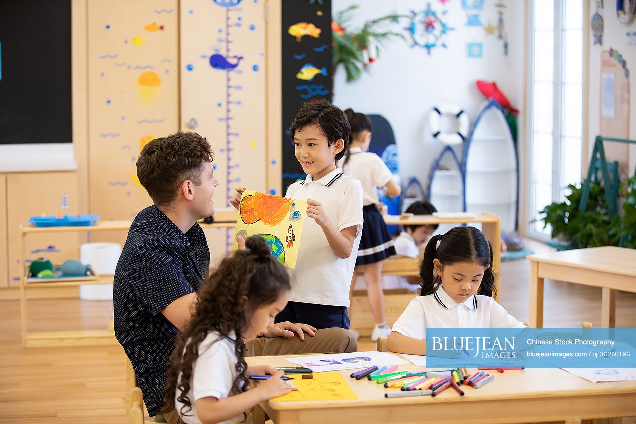 Foreign teacher teaching art class in classroom