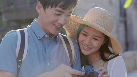 Happy young Chinese couple enjoying vacation,4K