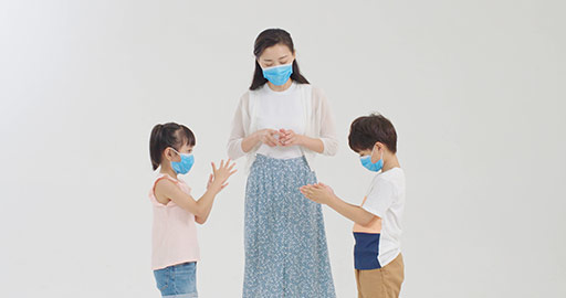 Chinese Children using hand sanitizer with mother's help,4K