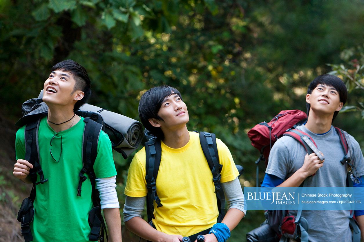 Young Chinese go hiking in mountain