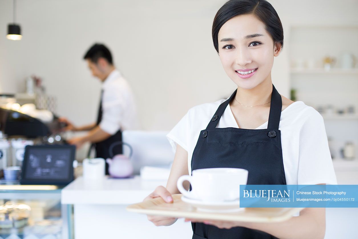 Portrait of Chinese coffee shop waitress