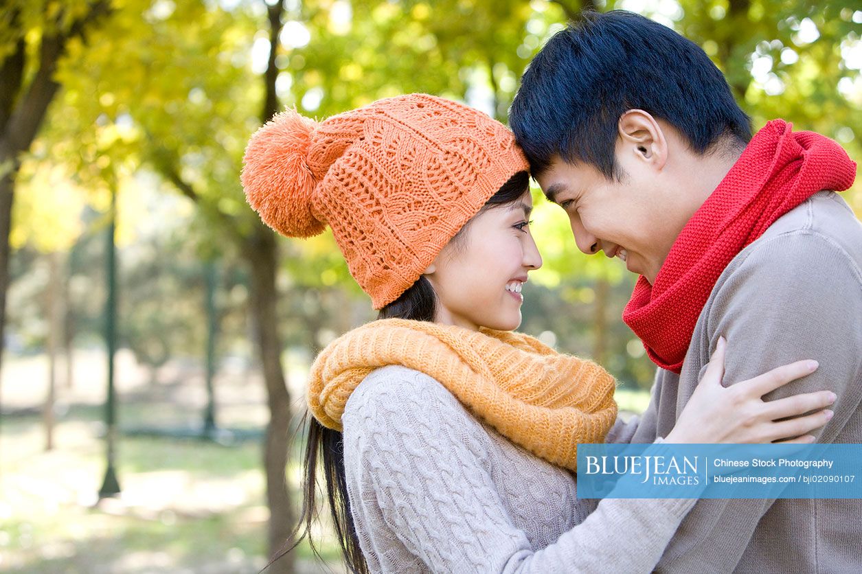 Young Chinese couple in a park in autumn-High-res stock photo for download