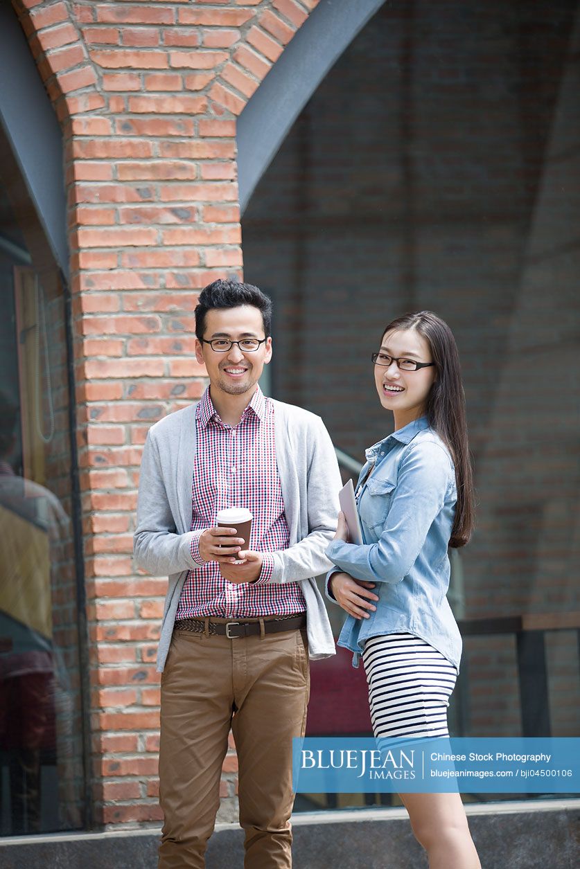 Happy Chinese business partners in cultural industry