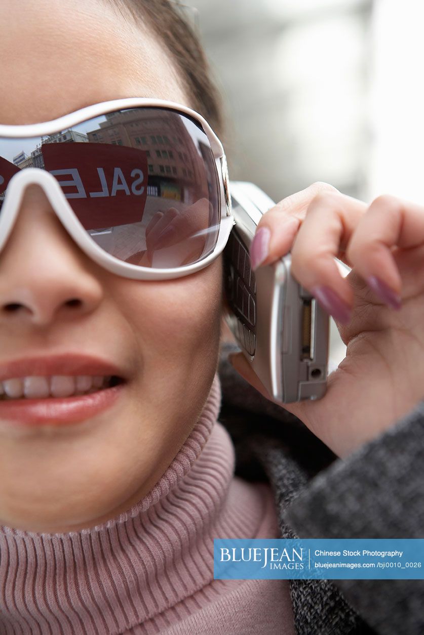 Close up of Chinese woman talking on the phone