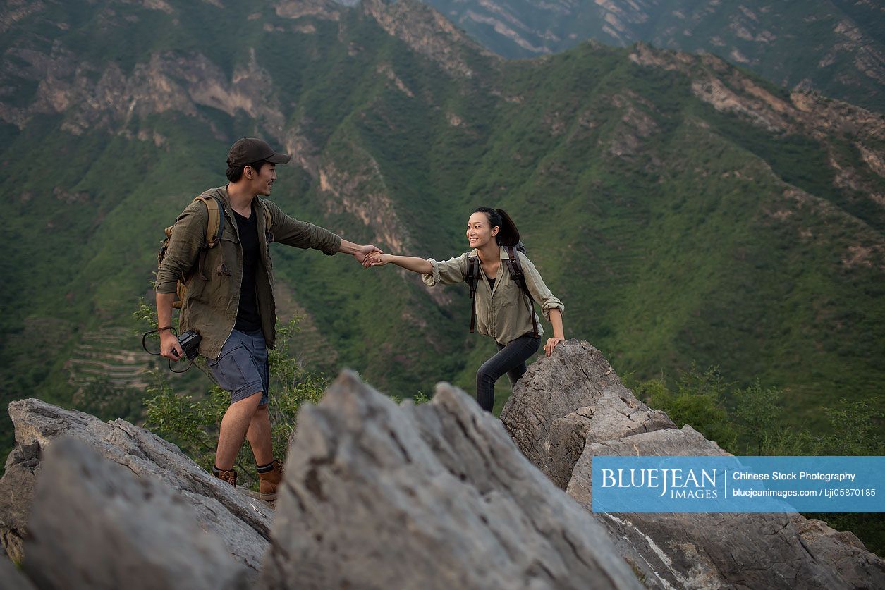Young couple hiking outdoors