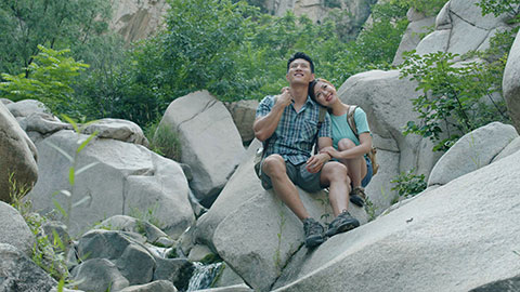 Happy young Chinese couple hiking outdoors,4K