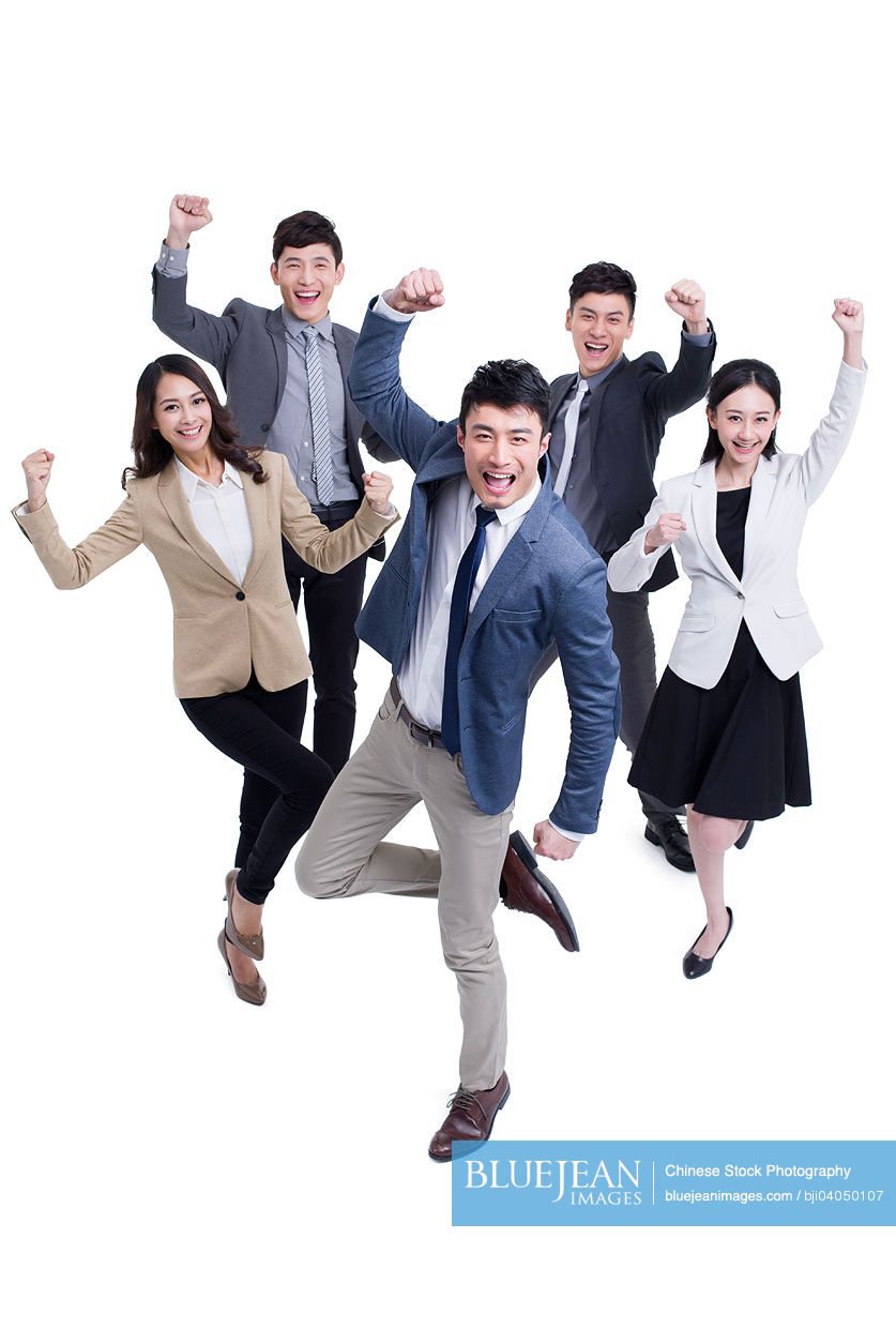 Excited Chinese business coworkers punching the air