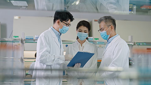 Three Chinese researchers discussing in laboratory,4K