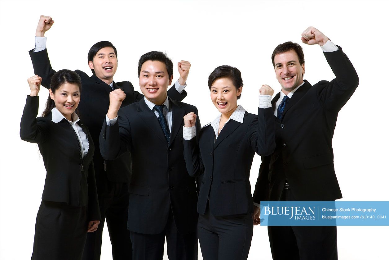 Excited business professionals on white background