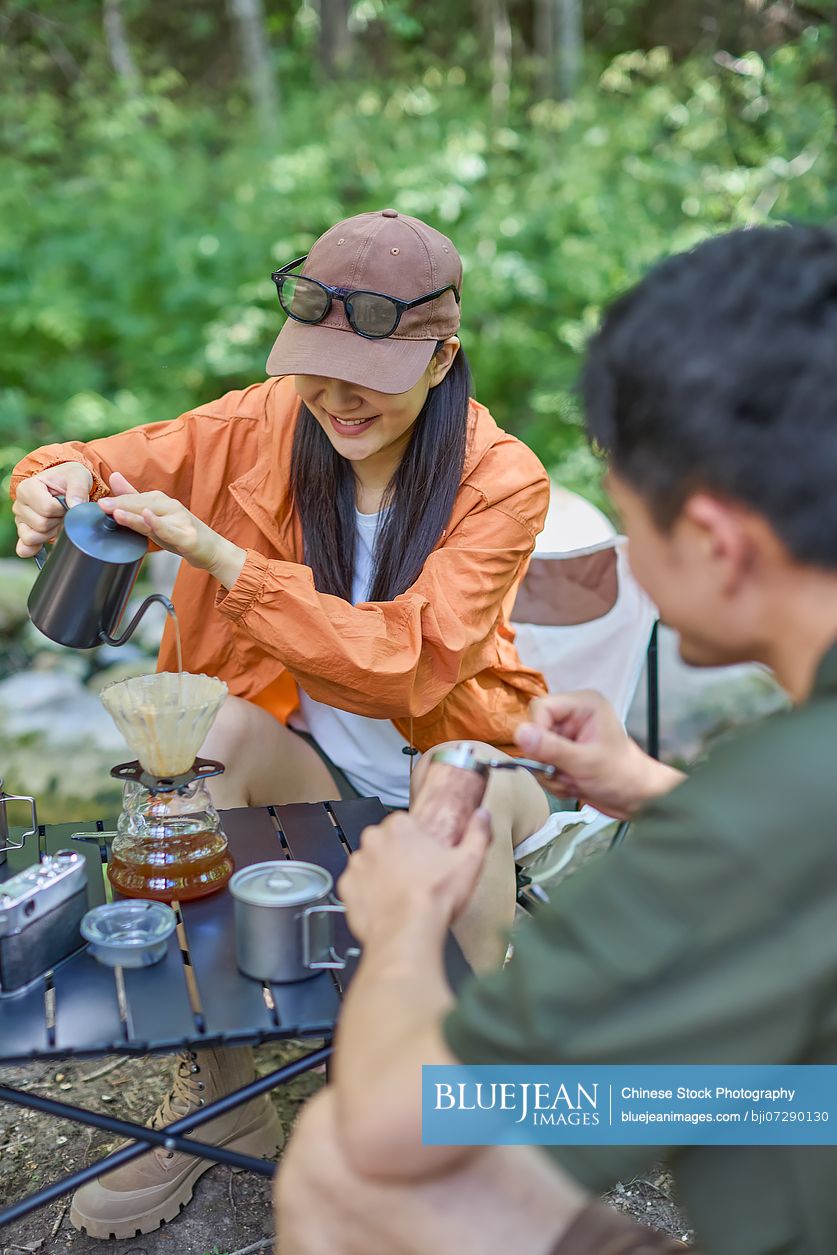 Happy couple sipping tea and enjoying the tranquil surroundings