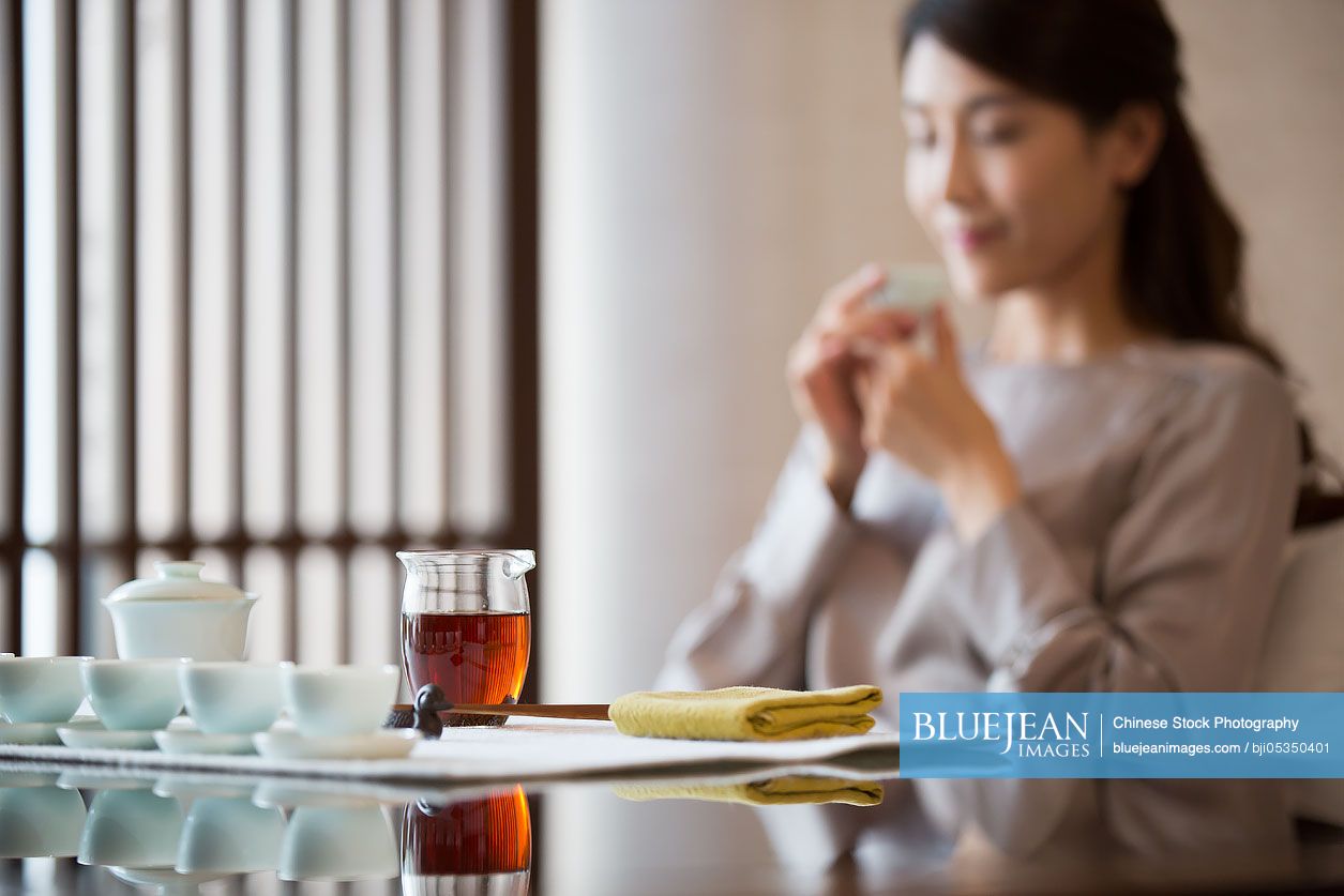 Young Chinese woman drinking tea