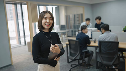 Confident Chinese businesswoman in office,4K
