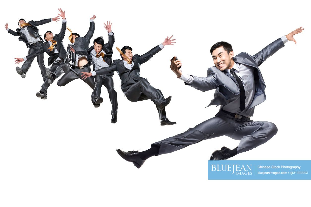 Chinese businessmen jumping and flipping in the air
