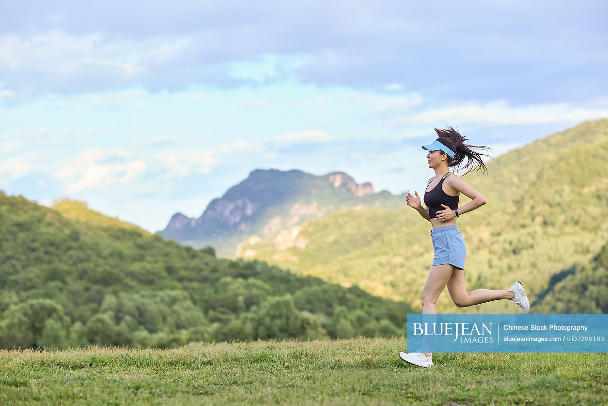 Young woman exercising in the heart of nature embracing the fresh air and natural surroundings