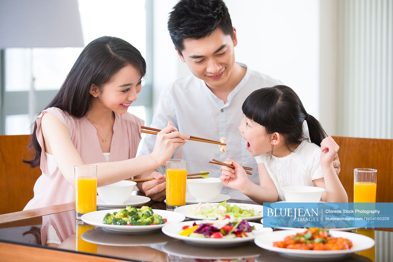 Happy Chinese family having lunch