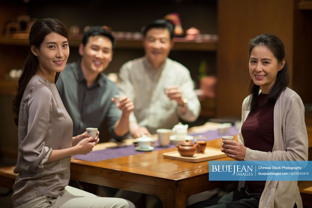 Chinese friends drinking tea together