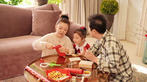 Family joyfully celebrating Chinese New Year together