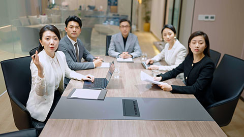 Confident Chinese business people having a meeting