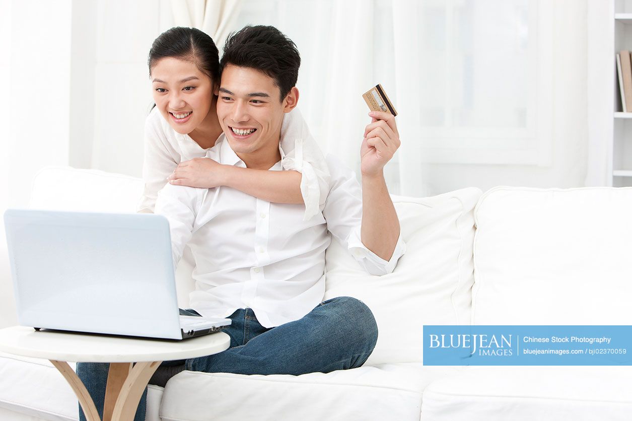 Young Chinese couple online shopping