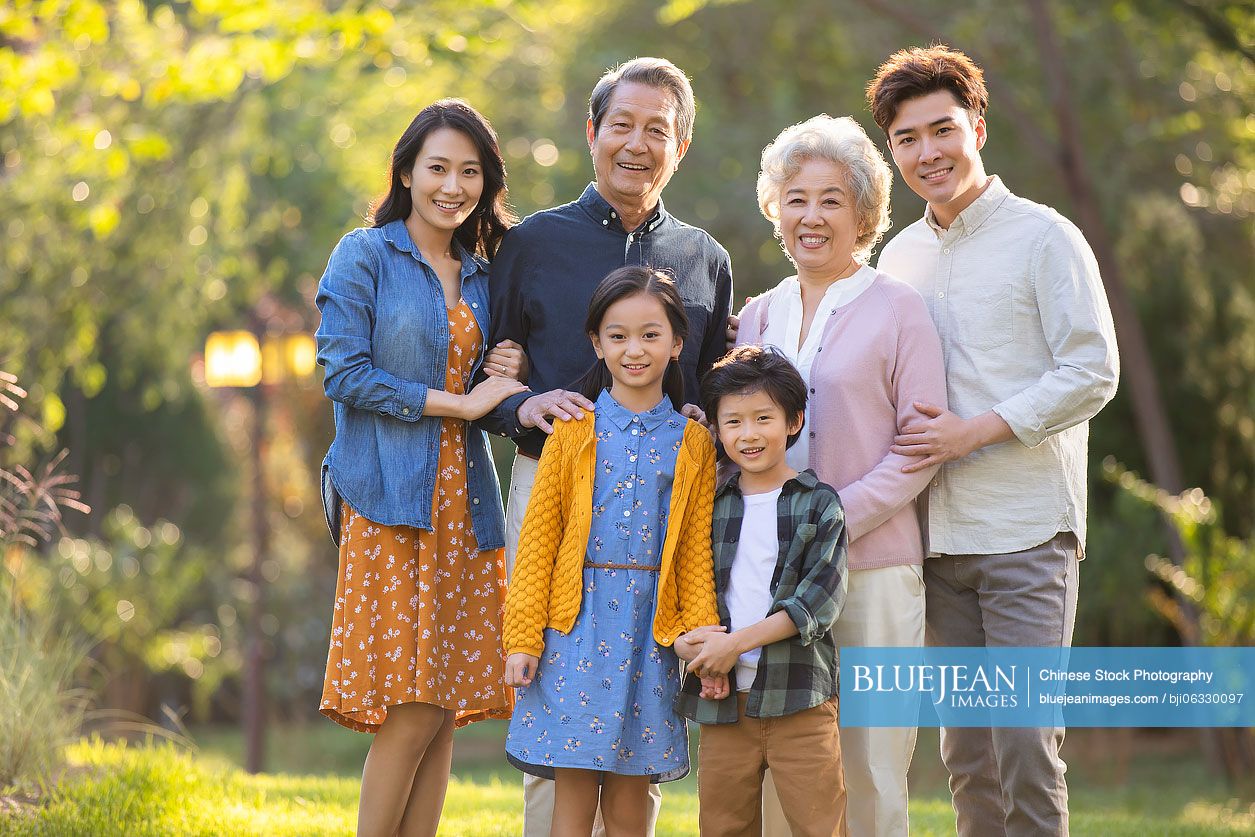 Happy Chinese family having fun in park