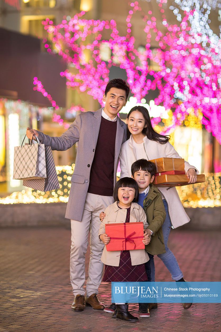 Cheerful young family shopping for Chinese new year