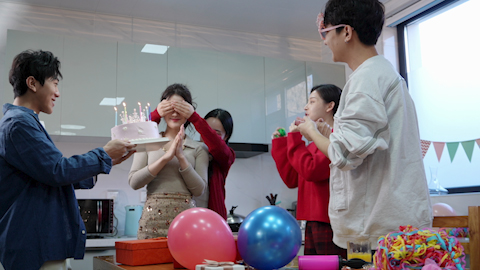 Young friends celebrating a birthday together