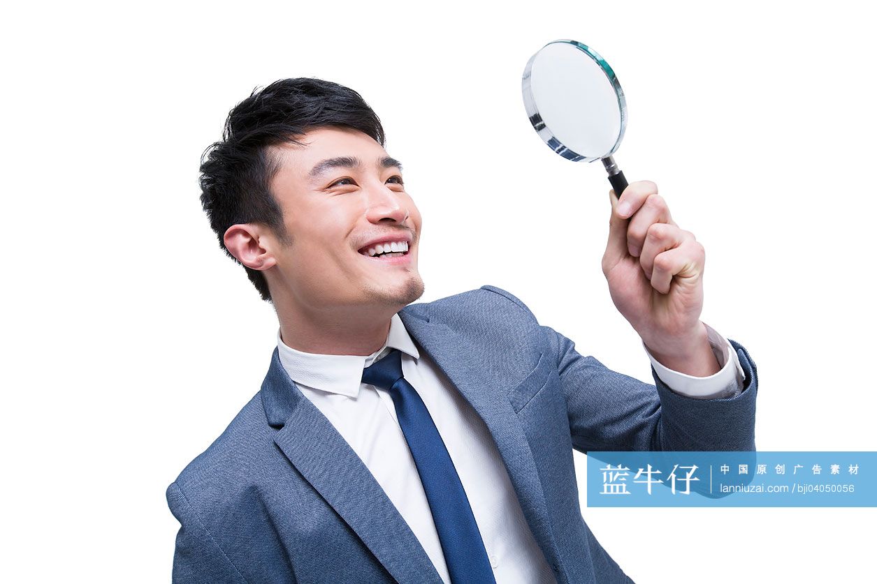 商务男士与放大镜