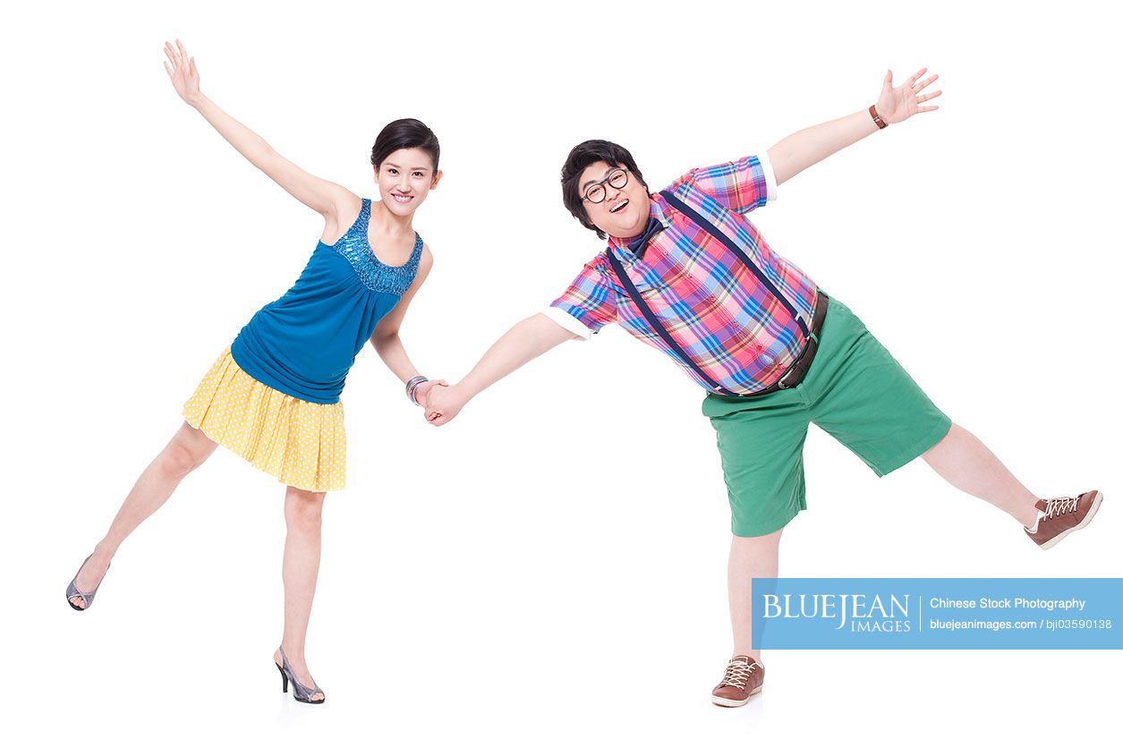 Happy Chubby Chinese man and girlfriend holding hands
