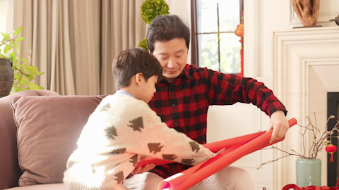 Family joyfully celebrating Chinese New Year together