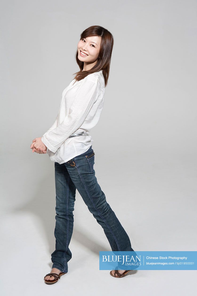 Portrait of shy young Chinese woman