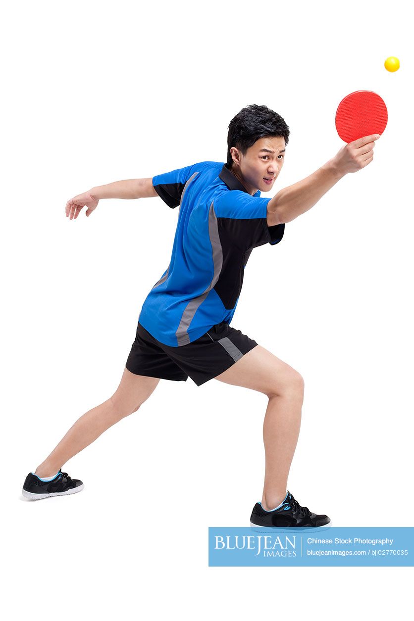 Chinese table tennis player bounces ball on paddleHighres stock photo