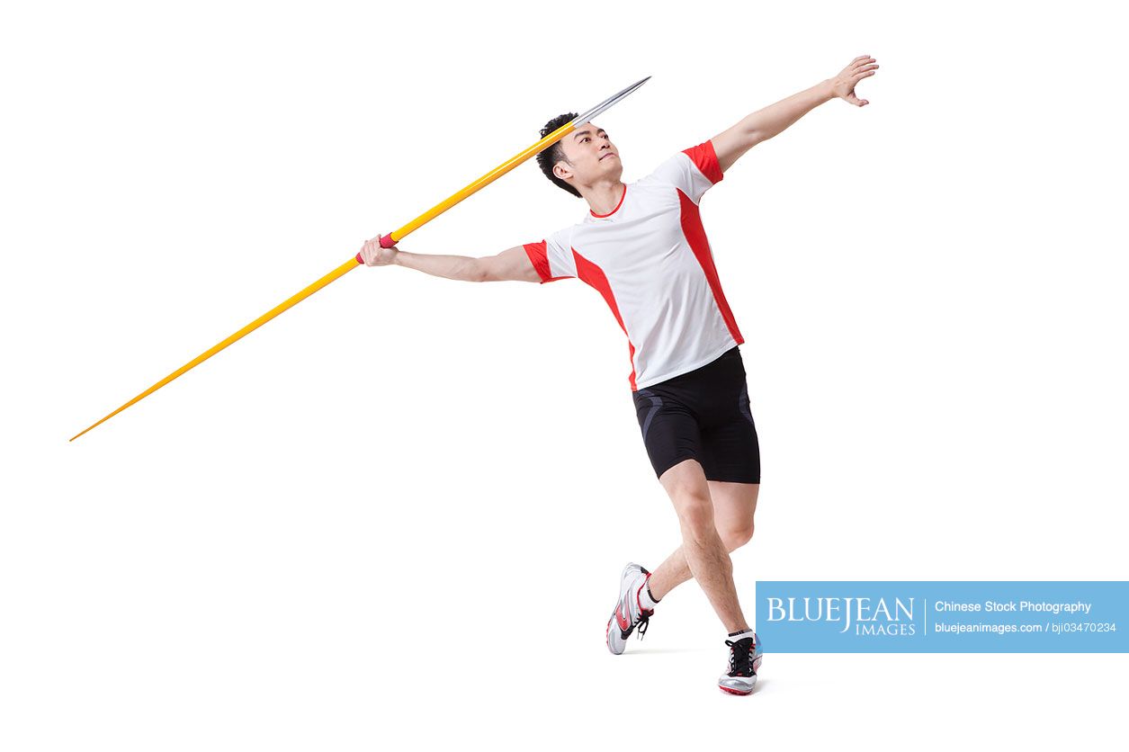 Male Chinese athlete throwing javelin