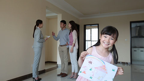 Happy little Chinese girl showing her drawing of new house,HD