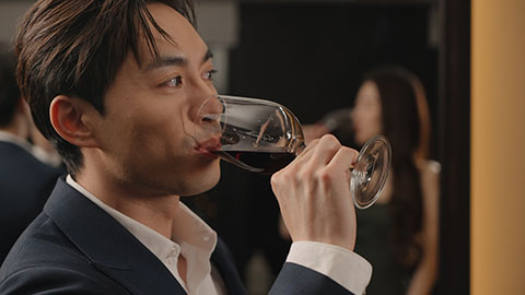 Elegant young Chinese couple enjoying red wine,4K